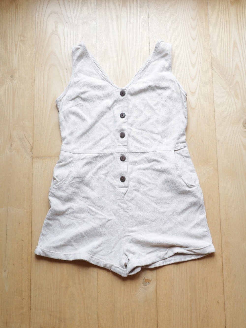 Cream colored button down romper